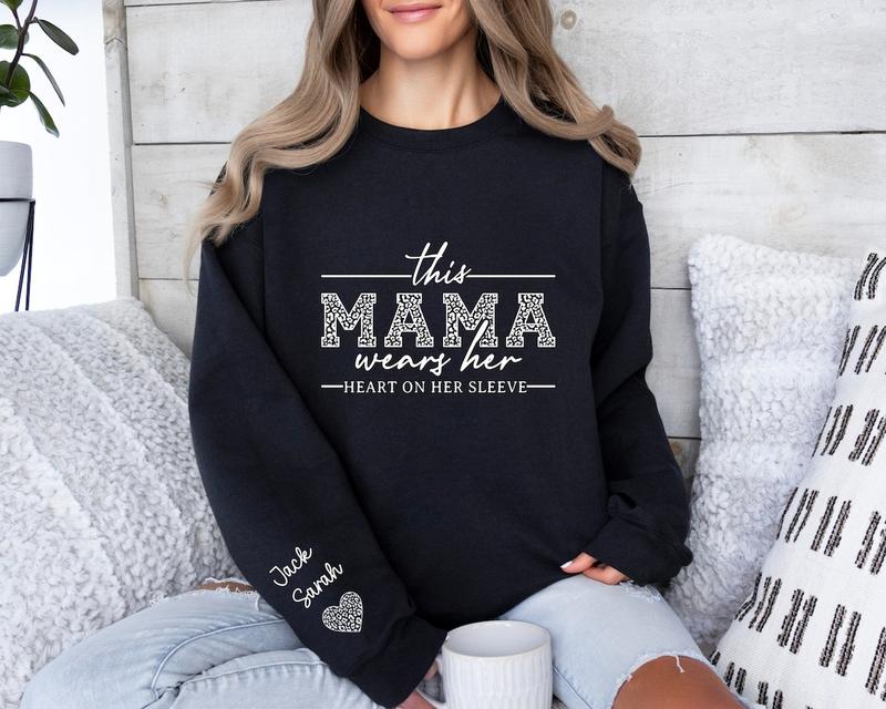 Custom Mama Sweatshirt With Kids Names On Sleeve, This Mama Wears Her Heart On Her Sleeve, Mom Christmas Crewneck Sweater, Mothers Day Gift for Mom